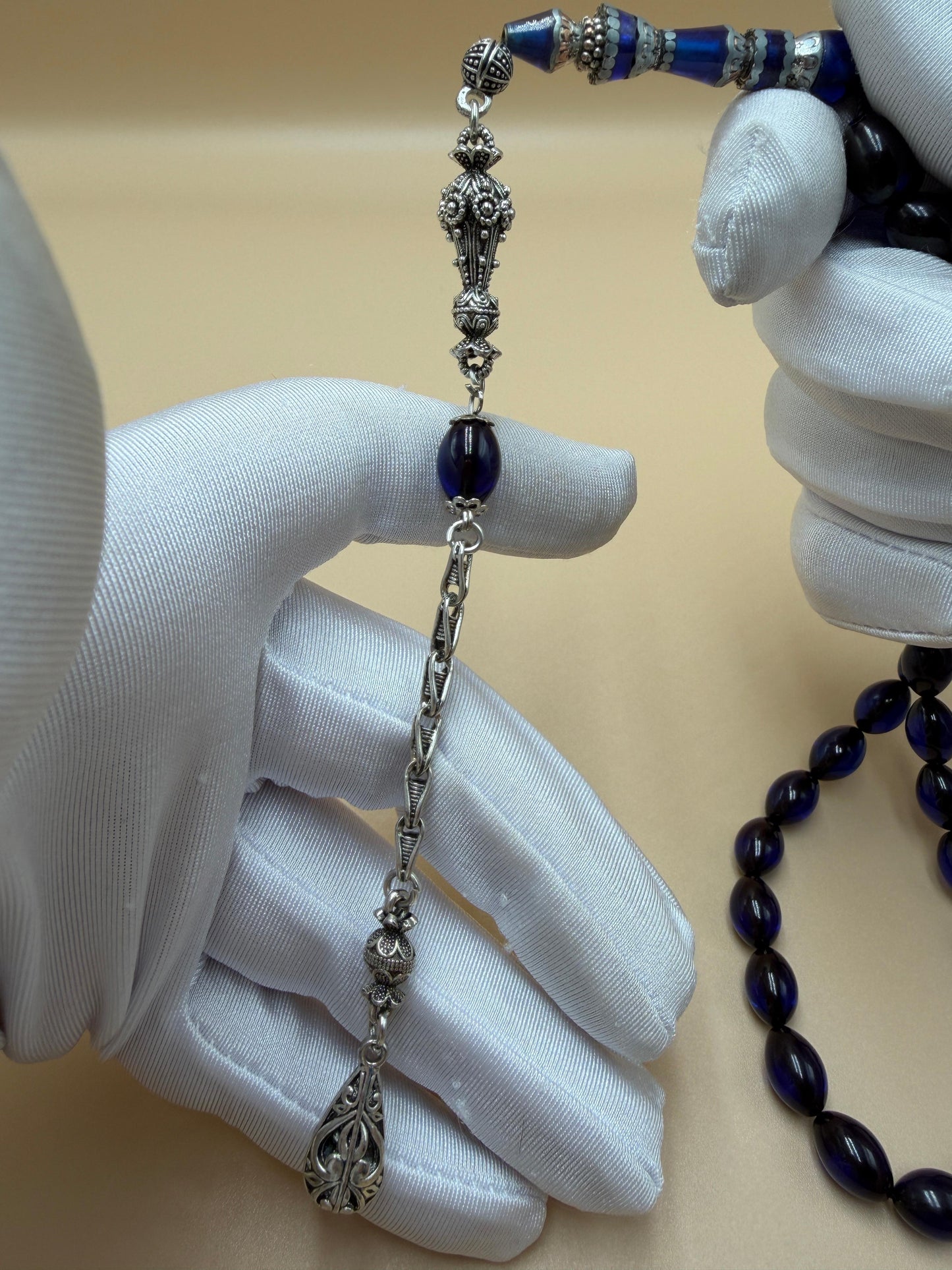 مسباح سندلوس أزرق، مأذنة مشغولة مميّزة. Blue Sandalwood Misbah with a Distinctive Handcrafted Minaret-Style Finial.