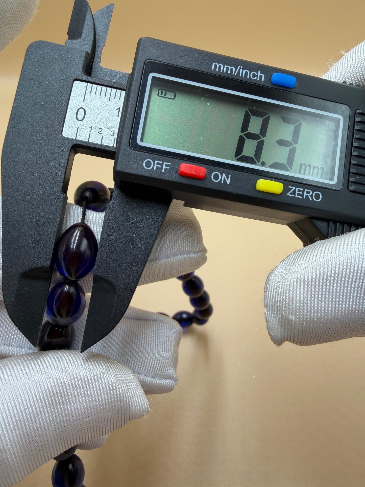 مسباح سندلوس أزرق، مأذنة مشغولة مميّزة. Blue Sandalwood Misbah with a Distinctive Handcrafted Minaret-Style Finial.