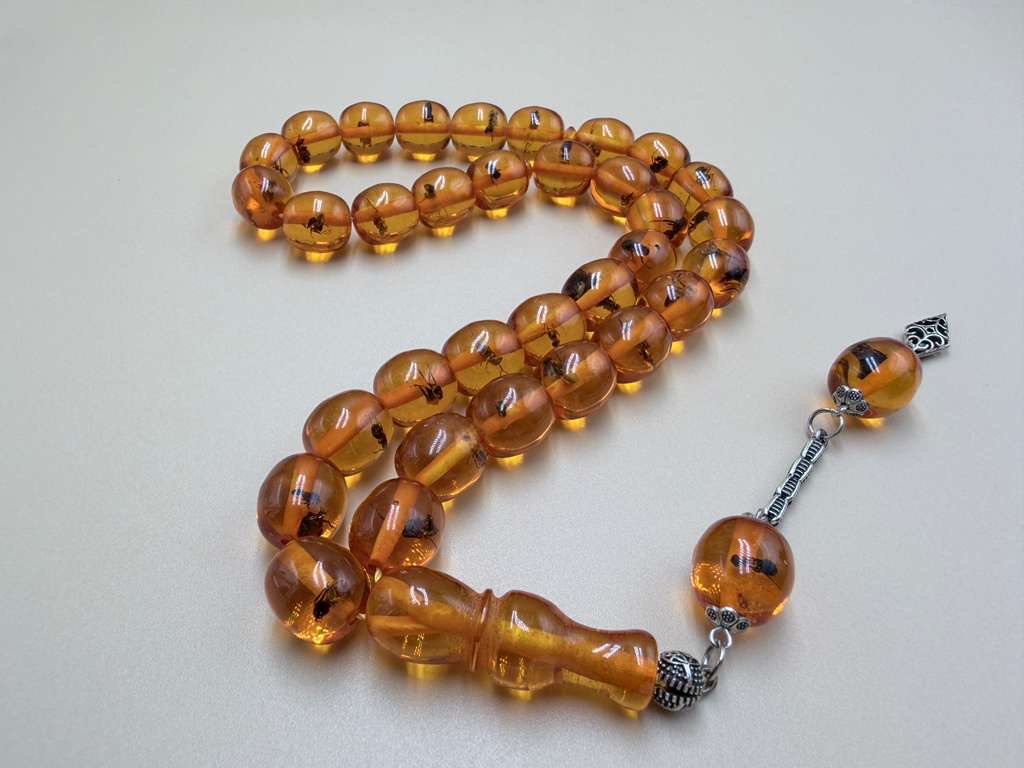 مسباح سندلوس داخله حشرات. Sandalwood Misbaha with natural insects inside.