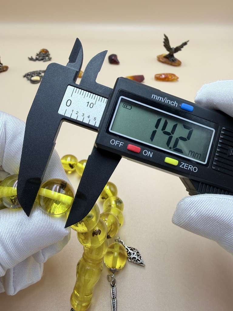 مسباح سندلوس داخله حشرات. Sandalwood Misbaha with natural insects inside.