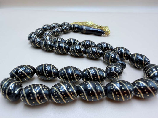 مسباح كوك، مطعّم سكروم، مع شرابة مطليّة ذهب عيار 24 Kuka Wood Misbah, Inlaid with Skroom, with 24K Gold-Plated Tassel.