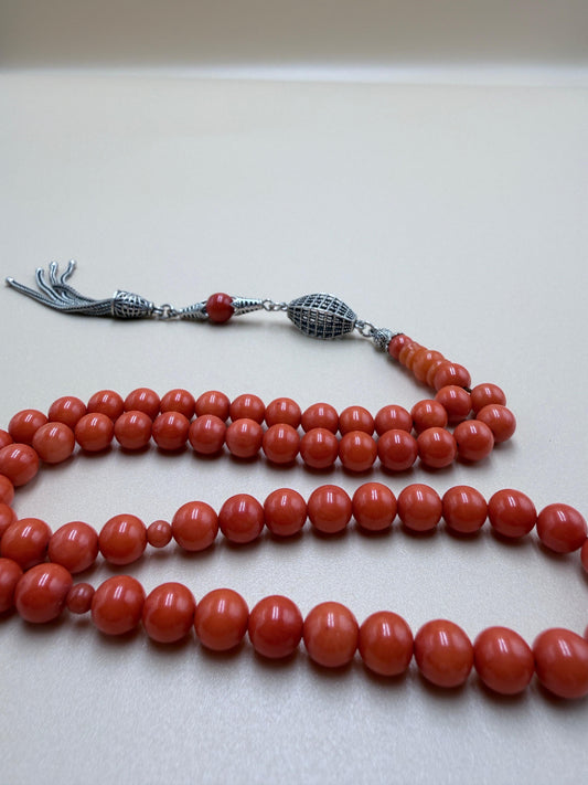 مسباح مرجان معالج بالليزر
مع شرّابة فضة عيار 925
Laser-treated Coral Misbaha
With 925 sterling silver tassel