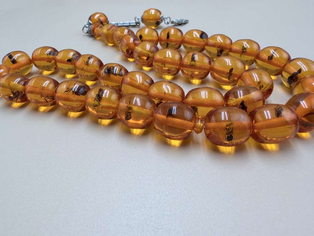مسباح سندلوس داخله حشرات. Sandalwood Misbaha with natural insects inside.