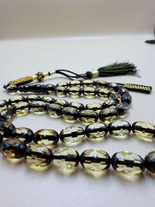 مسباح كهرمان (كهرب) حر
مترش – قصة بيض حمام
Amber (Kahrab) Misbaha – Natural
Polished – Pigeon egg cut