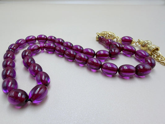 مسباح سندلوس كفّيه مع شرّابة مطلية ذهب
Sandaloos Misbaha (Kaffiyeh style)
With gold-plated tassel