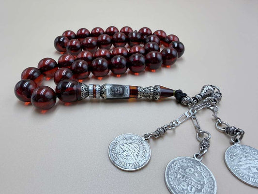 مسباح فاتوران أصلي
مع شاهد بصورة الرئيس صدام حسين
Vintage Faturan Misbaha
Featuring a bead with an image
