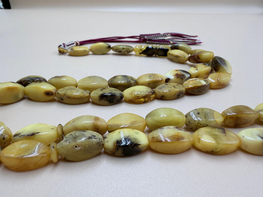 مسباح كهرمان بلطيقي حر شوائبي
قَصّة صابونيةNatural Baltic Amber Misbaha (Inclusion-rich)Soap-shaped cut