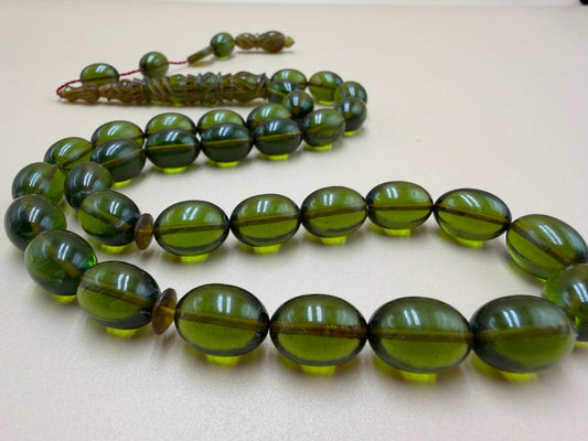 مسباح سندلوس شفاف نفطي، مع شاهد مميّز منقوش. Transparent Oily Sandalwood Misbah with a Distinctively Engraved Marker.